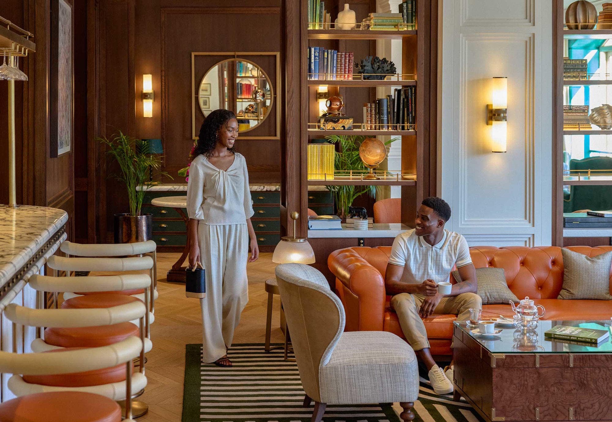 Cape Grace lobby — panelled walls, chesterfield seating and chevron parquet floors